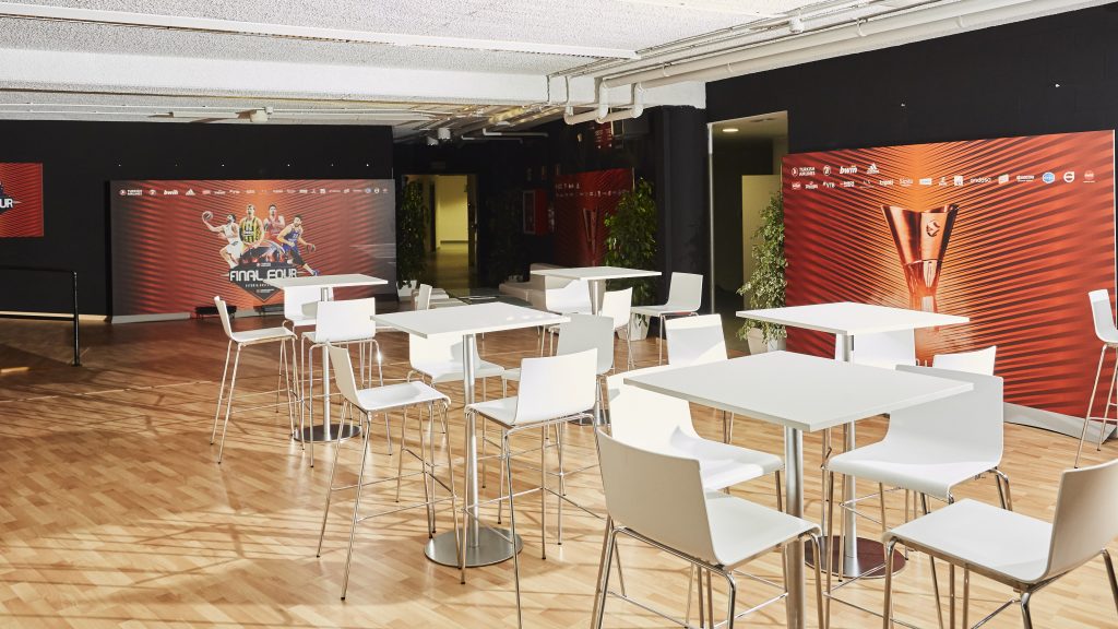Wall branding and table setup in VIP lounge at Euroleague Final Four